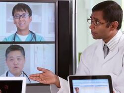 CU Medical Workers Discussing Patient Information with Doctors Using Video Conference / Richmond, Virginia, USA Stock Footage