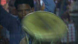 A musician rattles a drum. Stock Footage