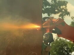 Iron Worker using Plasma Cutter with Toxic Yellow Smoke Stock Footage
