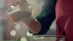Woman preparing dressing for a salad Stock Footage