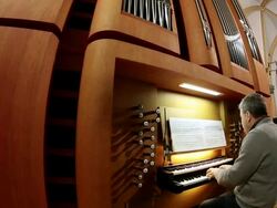 MS TU Organist at church organ playing with singing  / Saarburg, Rhineland-Palatinate, Germany Stock Footage