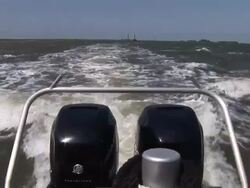 Medium static - Twin outboard motors propel a boat across ocean waters. / USA Stock Footage