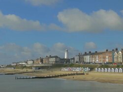 Southwold,colourful beach huts,People walking on promenade,,Lighthouse,WS, Stock Footage