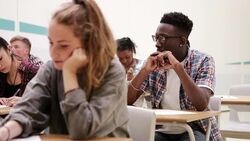Pensive boy taking test in classroom Stock Footage