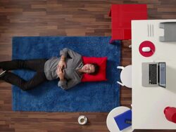 MS, ZI, CU, man sleeping and opening his eyes with surprise, overhead view Stock Footage