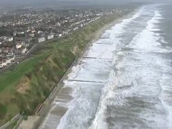 Aerials of Waves Crashing on Bournemouth Beach News Clip