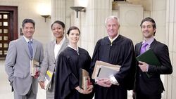 Judges and lawyers smiling in courthouse Stock Footage