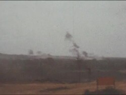 Amateur Vietnam Marine Footage of camp, tents, and a group of marines watching plumes of smoke against blue sunny skies. Stock Footage