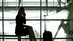 HD:Businesswoman working by using mobile phone at airport.. Stock Footage