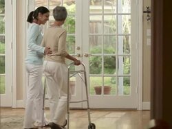Nurse assisting elderly woman Stock Footage