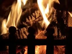 Close Up Of Logs Burning In Grate At Home Stock Footage