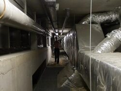 Inspection in the underground of technical plant by engineering woman Stock Footage