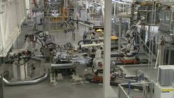Robots weld in an automotive factory. Stock Footage
