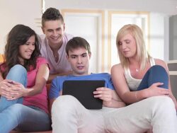 HD DOLLY: Group Of Teenagers Using Digital Tablet Stock Footage