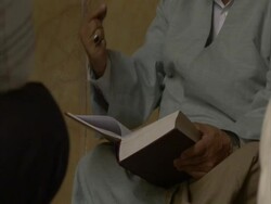 Cleric holding Koran, gesticulating with hands, Iran (sound available) Stock Footage