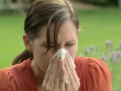 Young woman sneezing Stock Footage