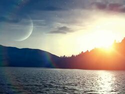 Sunset over water (loopable) Stock Footage