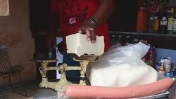 Cuba Tourism and Way of Life: Man Selling White Cheese by the Pound Stock Footage