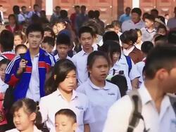 WS ZI SLO MO Crowd of kids of every age  moving out of school / Vientiane, Laos Stock Footage