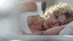 Lonely Woman Lying In Bed Stock Footage