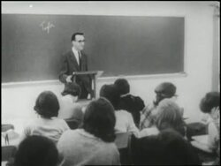 A college professor instructs a classroom of young women. News Clip