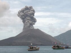 Large eruption of volcanic ash at Anak Krakatau with boats nearby, Krakatoa, Indonesia, November 2010 Stock Footage