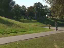 Olympiapark,  Park, biker, trees,  sunny, blue sky, lake, water Stock Footage
