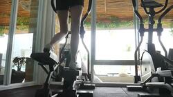 Woman Using Running Machines In Gym Stock Footage