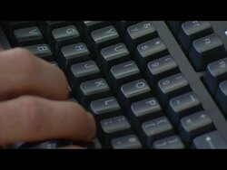 Anonymous Male Office Worker at Computer News Clip