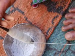 ECU HA Shot of Hands spinning yarn / Soe, Mt. Mutis, West Timor Indonesia Stock Footage