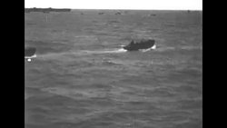 Landing crafts and ships on ocean during WW II News Clip