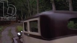 Car driving through the countryside, 1930s - reenactment, clip 8 Stock Footage