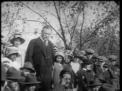 B/W 1910s Theodore Roosevelt standing with children + saluting / World War I / newsreel Stock Footage