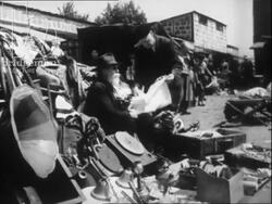 City of Treasures part 7 - girl and boy in market. Men repairing/restoring antiques. Paris 1951 Stock Footage
