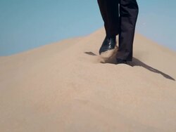 Businessman in desert Stock Footage