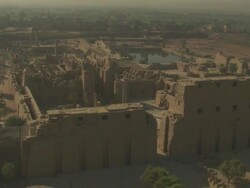 High Angle, aerial - Sandstone historical ruins with large pillars stand out in the Egyptian Nile Delta Stock Footage