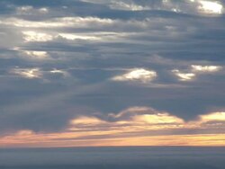 WS T/L Sunset light beaming through clouds in sky / Big Sur, California, United States Stock Footage