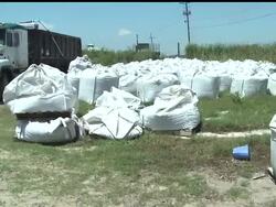 BP crews will be gathering water and sand samples on Grand Isle in Louisiana as boom and other supplies have slowly started to trickle in.  However the local mayor is worried BP will hire outside contractors to do the work. News Clip