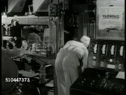 1949: SWEDEN NEWSPAPER: INT MS Swedish worker operating printing press machine. MS Workers stacking bundles of newspapers. EXT MS Man reading newspaper on bench (possibly park). Instructional Video