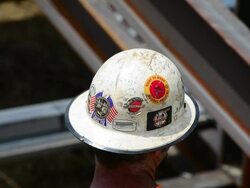 Closeup of a steelworker's hard hat Stock Footage