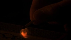 Striking match on a matchbox in slow motion. Stock Footage