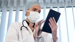 Female surgeon make research with digital tablet Stock Footage
