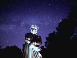MS T/L PAN Shot of Jesus stone statue under stars / Jeju, Jeju-do, South Korea Stock Footage