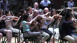 Composer John Williams, famous for his iconic movie scores, led the Detroit Symphony Orchestra through a rehearsal of some of those pieces, which they will play during a special benefit concert on Saturday night.  (June 13) Instructional Video