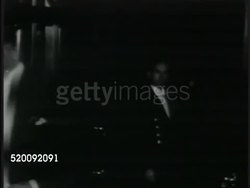 1935: AMBASSADOR'S DINNER PARTY: Guests, diplomats arriving at Spaso House black tie dinner, guests being served dinner, ornate dinner table setting, guests standing at dinner table making toast (no SOT). Russia. Instructional Video