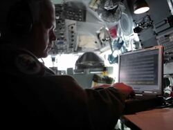 MS Air Force personnel working on computer during flight, Colorado Rockies, Colorado, USA Stock Footage