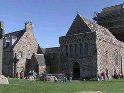 PAN Visitors walking the grounds of Iona Abby / Isle of Iona, Scotland, United Kingdom Stock Footage