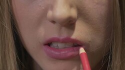 Using lip liner Stock Footage