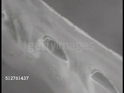1943: PACIFIC THEATER: AERIAL: (POV Aircraft) Moving over atoll being shelled w/ bombs, bombed. WS Aircraft in diving flight.   World War II. WWII. Instructional Video