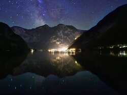 T/L star trails reflected in Lake Hallstatt Stock Footage